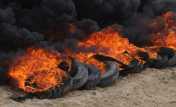 Burning tires during the Joint exercises of rescue services in Kiev and Kiev region with employees of the MSW landfill number 5 in Podgortsy (Kiev region), July 6, 2017