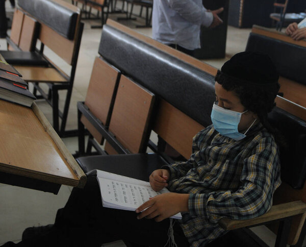 Hasidic boy, wearing a medical mask, in Uman (Cherkasy region), August 20, 2020.
