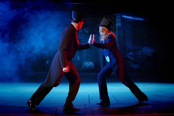 young actress in a tuxedo on the stage of the theater