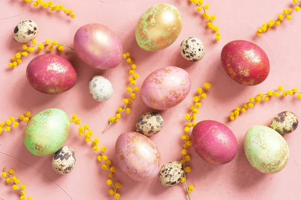 Pattern with pink Easter eggs with golden spots and flowers
