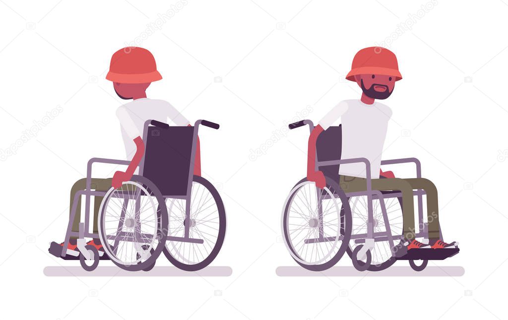 Male black young wheelchair user moving manual chair