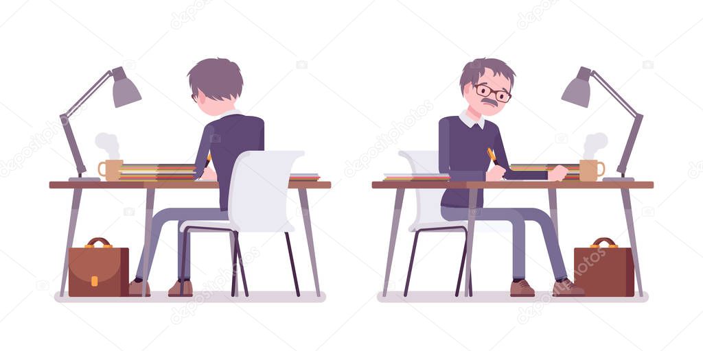 Male teacher sitting and working at the desk