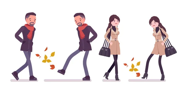 Elegáns férfi, nő az őszi ruhákat séta a sárga levelek — Stock Vector