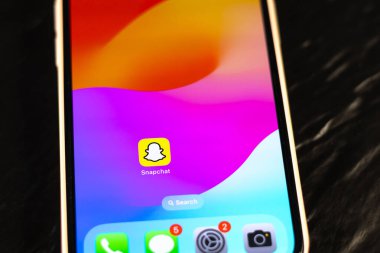 KYIV, UKRAINE - September 15, 2025 : Modern smartphone Apple iPhone with snapchat mobile app. Close up.
