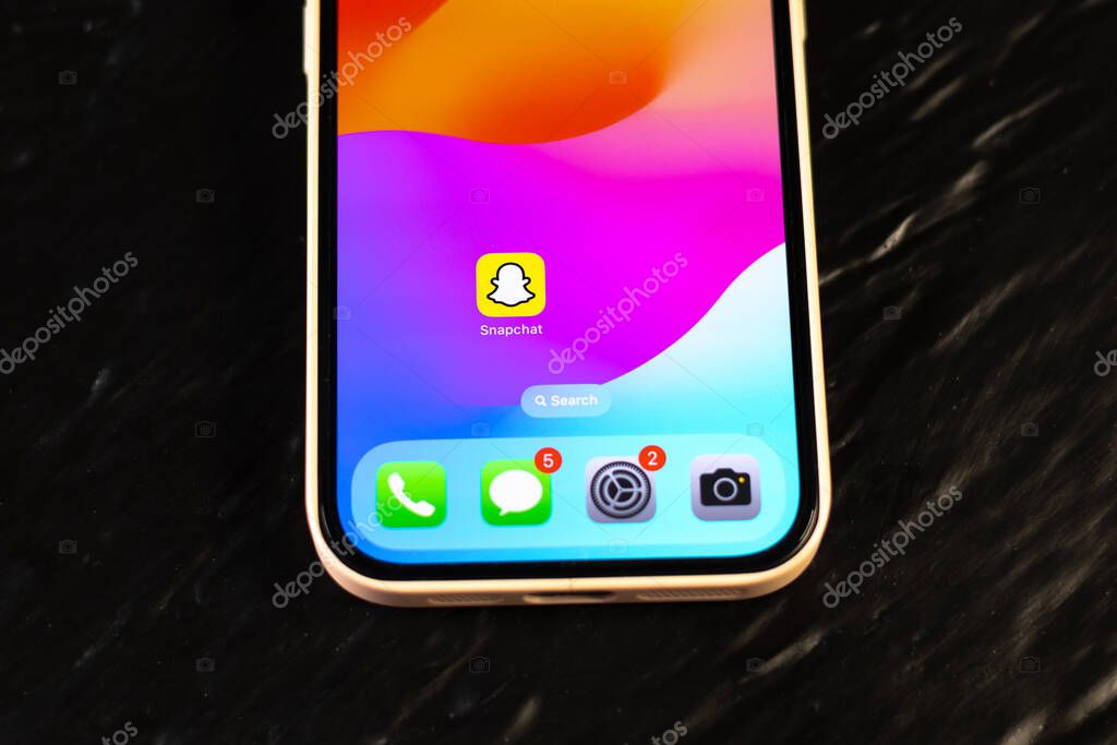 KYIV, UKRAINE - September 15, 2025 : Modern smartphone Apple iPhone with snapchat mobile app. Close up.