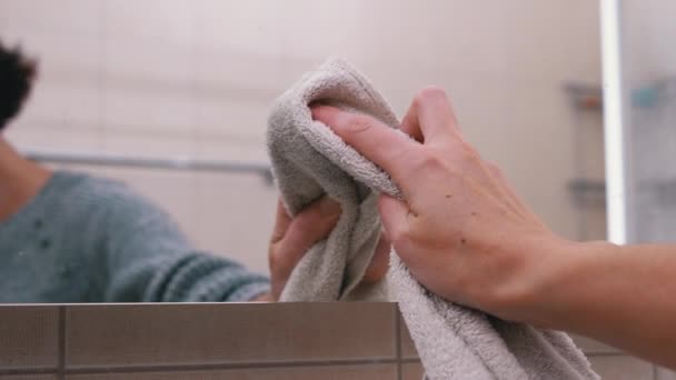 Female Hand Washes Mirror. Reflection in Mirror of a Female Silhouette — Stock Video