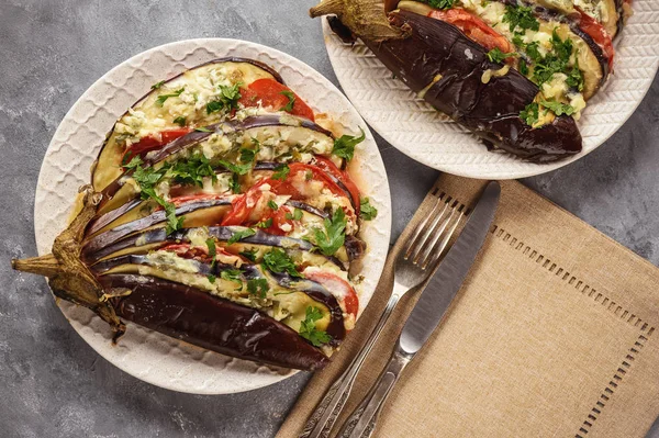 Roasted eggplant fan with mozzarella, tomatoes and parsley.