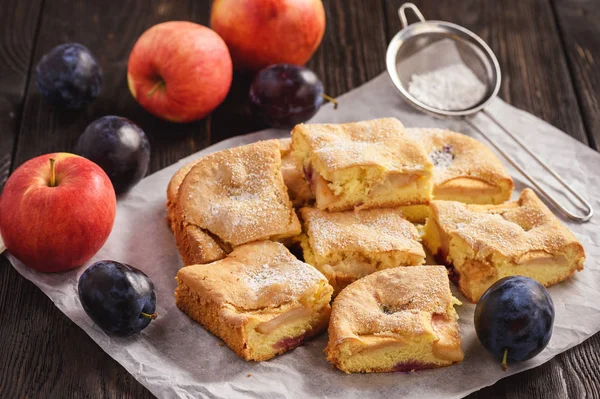 Homemade cake with apples and plums.