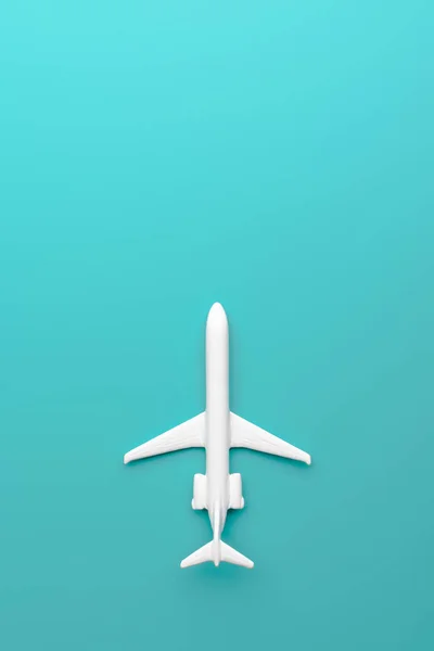 Shot Tiny Toy Airplane White Color Lying Bright Turquoise Background — Stock Photo, Image