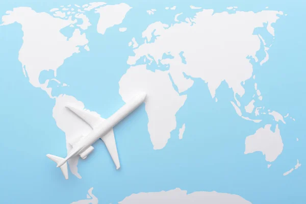 Top View Miniature Plane Placed Top Blue White Colored Map — Stock Photo, Image