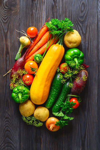 Eco food concept. Various fresh vegetables on dark wooden background. healthy food clean eating. Cellulose fiber source.