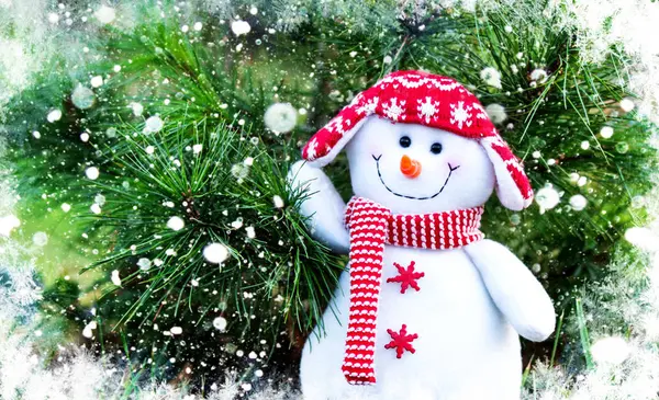snowman in a red hat and scarf on a Christmas tree background