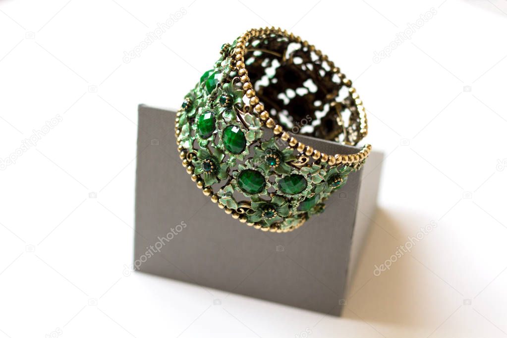 exquisite jade bracelet with metal weave on a light background