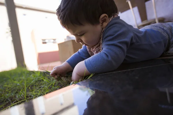 Beautiful Baby Boy Fidgeting Grass — Stock Photo, Image