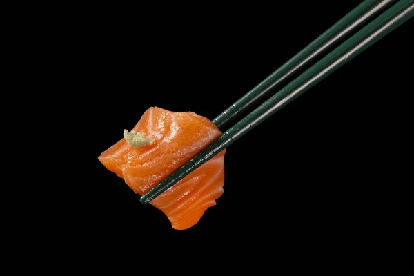 Hashi Hold Sushi Rolls Isolated Black Background — Stock Photo, Image