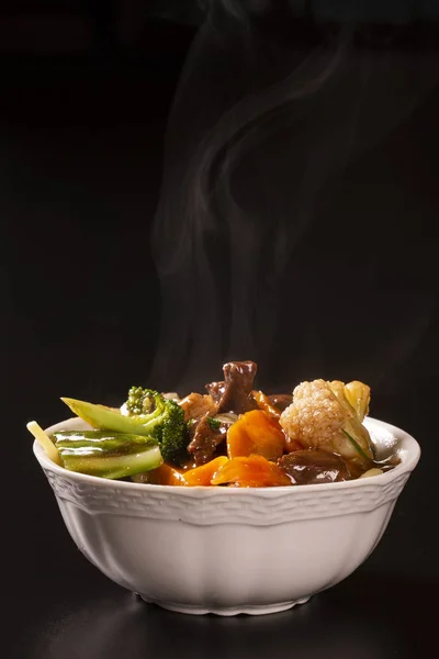 Japanese food. meet and vegetables with smoke. Yakisoba