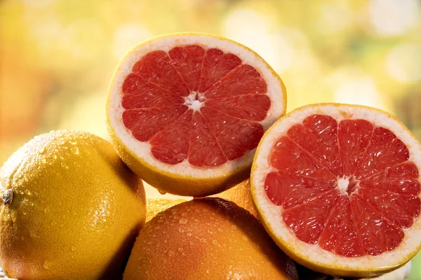 Freshly red grapefruit on wooden background — Stock Photo, Image