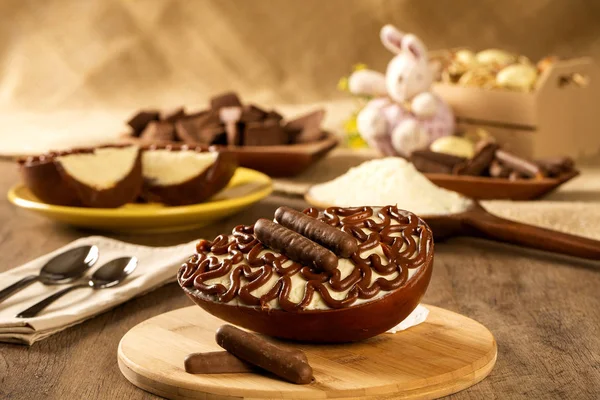 Gourmet easter egg, stuffed with cream and chocolate. Easter egg with pudding cream, Easter dessert. Easter concept.