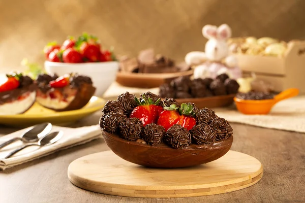 Gourmet easter egg, stuffed with chocolate and strawberry. Easter egg with pudding cream, Easter dessert. Easter concept