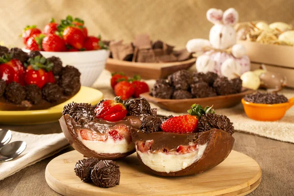 Gourmet easter egg, stuffed with chocolate and strawberry. Easter egg with pudding cream, Easter dessert. Easter concept