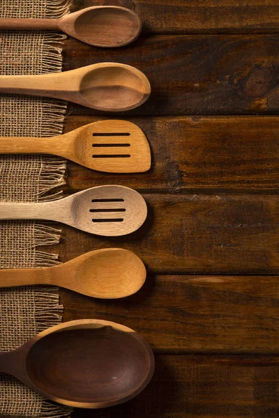 Wood spoons on wooden table. Top view — Stock Photo, Image