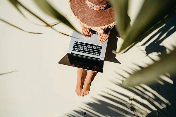 Woman working through internet in tropics Royalty Free Stock Images