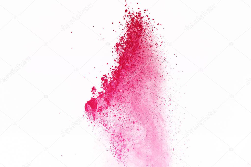 Red powder explosion on white background. Red dust explosive on white background. Paint holi. Stop motion of red powder on isolate background.