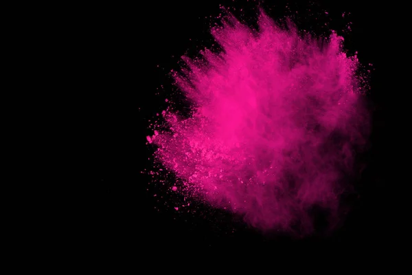 Siyah arka plan üzerine soyut pembe toz patlama. renkli toz splatted abstract, pembe toz patlayan hareket dondurmak.