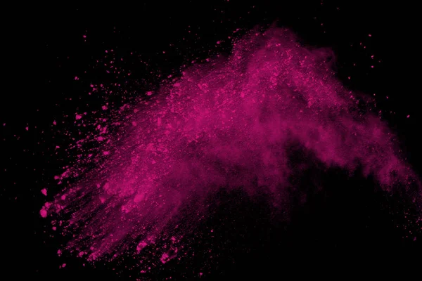 Siyah arka plan üzerine soyut pembe toz patlama. renkli toz splatted abstract, pembe toz patlayan hareket dondurmak.