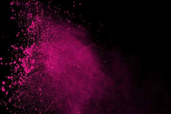Siyah arka plan üzerine soyut pembe toz patlama. renkli toz splatted abstract, pembe toz patlayan hareket dondurmak.