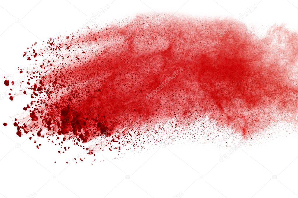 Abstract red powder explosion on white background. abstract red dust splatted on white background, Freeze motion of red powder exploding.