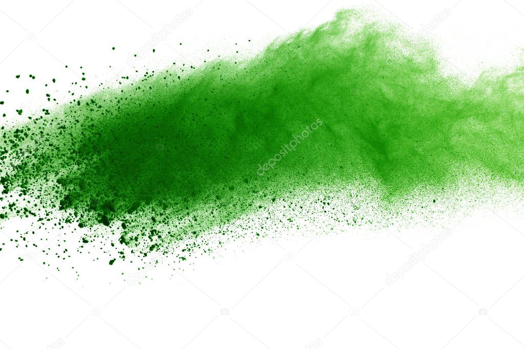 Freeze motion of Green powder exploding on white background.