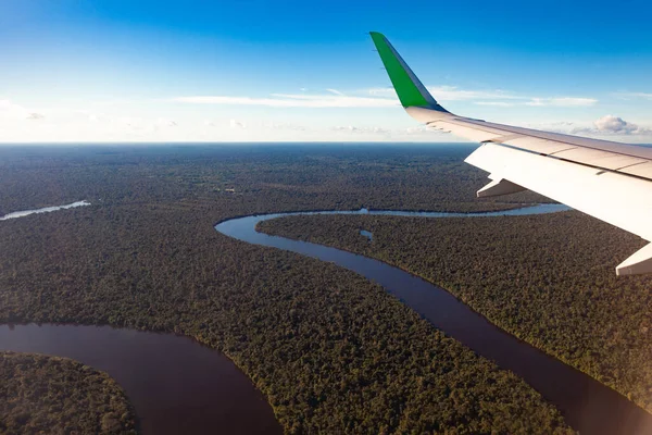 Amazonas river, view from the plane, wing of the plane, travel concept.
