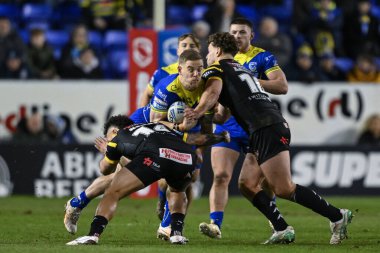 James Harrison of Warrington Wolves is tackled by Liam Horne of Castleford Tigers and Elie El-Zakhem of Castleford Tigers during the Betfred Super League Round 3 match Warrington Wolves vs Castleford Tigers at Halliwell Jones Stadium, Warrington, Uni clipart