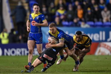 Matt Dufty of Warrington Wolves is tackled by Jacob Miller of Castleford Tigers during the Betfred Super League Round 3 match Warrington Wolves vs Castleford Tigers at Halliwell Jones Stadium, Warrington, United Kingdom, 1st March 202 clipart