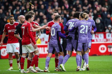 Jayden Danns of Liverpool is shown a yellow card by referee Paul Tierney during the Premier League match Nottingham Forest vs Liverpool at City Ground, Nottingham, United Kingdom, 2nd March 202 clipart