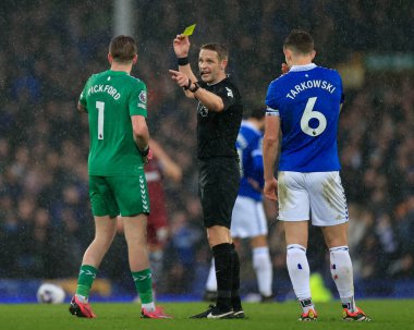 Referee Craig Pawson shows a yellow card to Jordan Pickford of Everton during the Premier League match Everton vs West Ham United at Goodison Park, Liverpool, United Kingdom, 2nd March 202 clipart