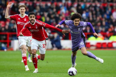 Andrew Omobamidele of Nottingham Forest and Jayden Danns of Liverpool battle for the ball during the Premier League match Nottingham Forest vs Liverpool at City Ground, Nottingham, United Kingdom, 2nd March 202 clipart
