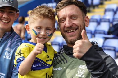 Genç bir Warrington taraftarı, 6 Eylül 2025 'te İngiltere' nin Warrington şehrindeki Halliwell Jones Stadyumu 'nda oynanan 25.