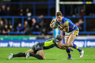 Leeds Gergedan takımından Morgan Gannon, Betfred Süper Lig 26. Maç Leeds Gergedan ve Ejderhalar karşılaşmasında topla birlikte Headingley Stadyumu, Leeds, İngiltere 'de 11 Eylül 2025' te sona eriyor.