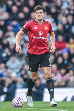 Manchester City - Manchester United Premier League maçı sırasında Manchester Stadyumu 'nda oynayan Harry Maguire, 14 Eylül 2025 