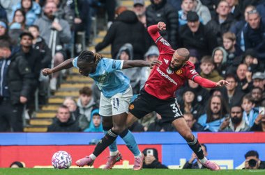 Manchester City 'den Jeremy Doku ve Manchester United' dan Noussair Mazraoui Premier Lig karşılaşmasında Manchester City ile Manchester United Etihad Stadyumu 'nda 14 Eylül 2025' de karşı karşıya geldiler.