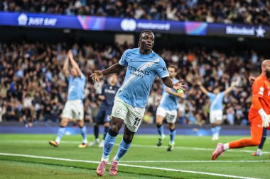 Manchester City 'den Jeremy Doku, UEFA Şampiyonlar Ligi 25 / 26 Faz MD1 Manchester City' nin Napoli Ligi 'ne karşı 18 Eylül 2025' te Manchester, İngiltere 'deki The City of Manchester Stadyumu' nda 2-0 'lık galibiyet golünü kutluyor. 