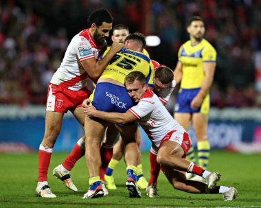 Tyrone May of Hull KR and Jez Litten of Hull KR tackle Joe Philbin of Warrington Wolves during the Betfred Super League round 27 match Hull KR vs Warrington Wolves at Sewell Group Craven Park, Kingston upon Hull, United Kingdom, 18th September 2025 