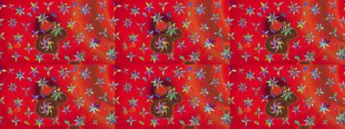 Kırmızı ve turuncu renkli bitkilerden oluşan parlak çiçekli çizim deseni.