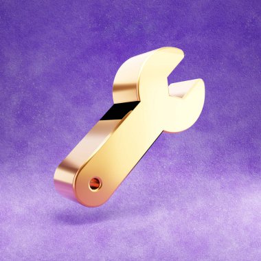 Anahtar simgesi. Mor kadife arka planda izole edilmiş altın renkli İngiliz anahtarı sembolü.