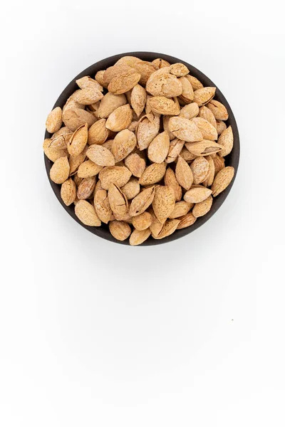 Roasted Salty Almonds Nuts Shells Bowl White Background Top View — Stock Photo, Image