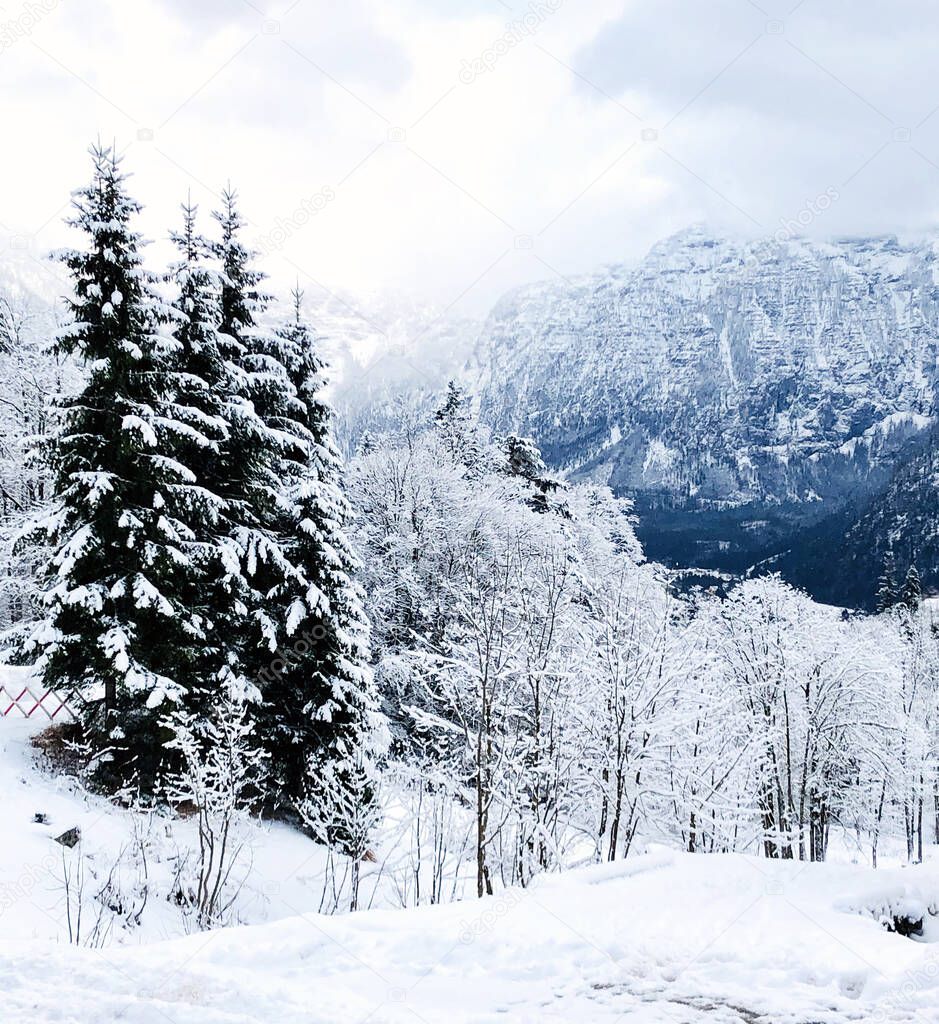 Hallstatt dreamscape winter snow mountain landscape outdoor adventure with blue sky in snowy day, Austria