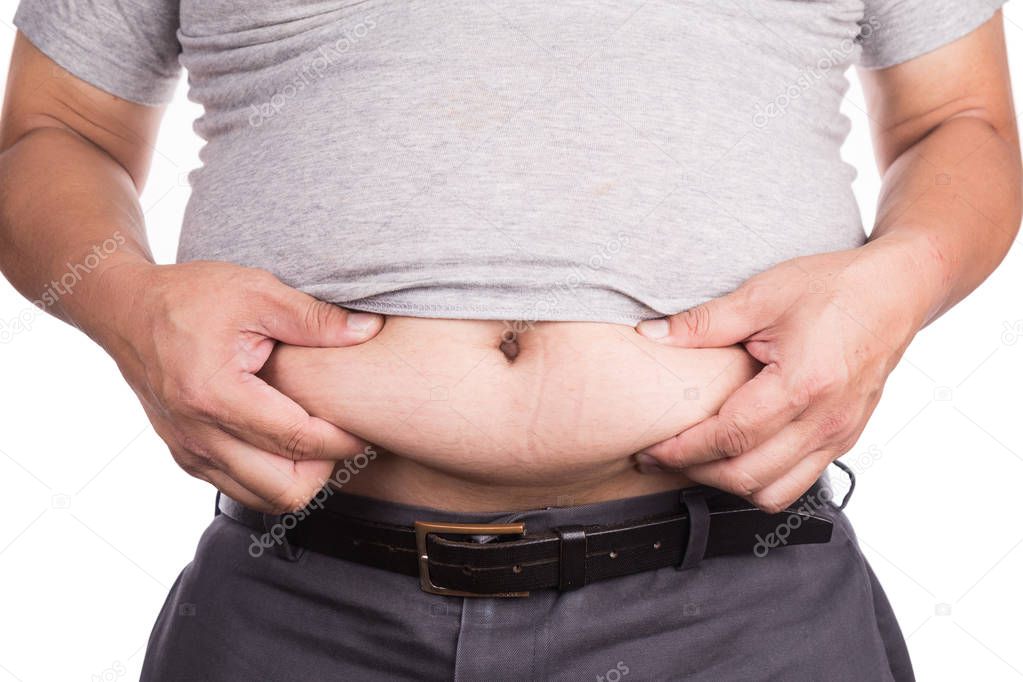 Close-up of man holding unhealthy big belly with visceral and subcutaneous fats. Pose health risk