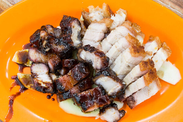 Simple serving of delicious Chinese style roast pork or siew yuk and char siew